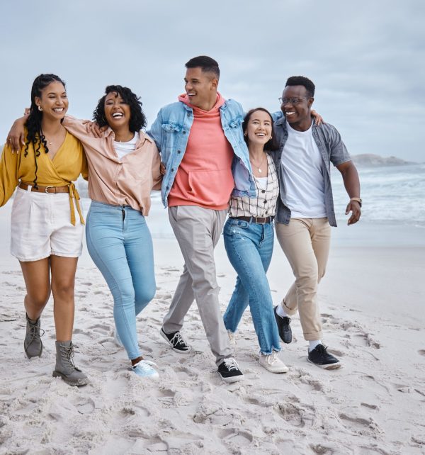 Happy, diversity and friends walking at the beach for holiday, vacation and bonding on nature backg.